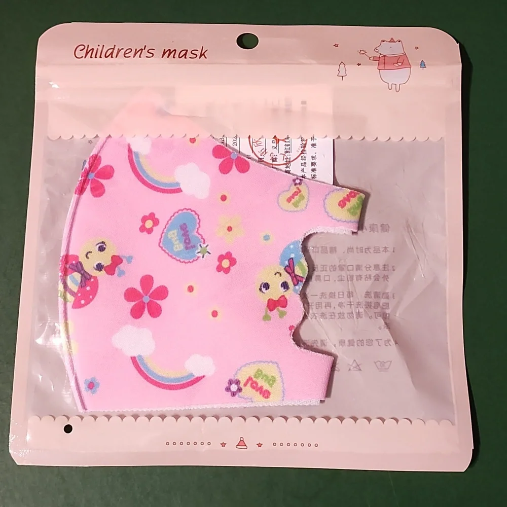 Children's re Usable face mask new in package never opened